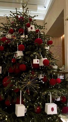 a christmas tree decorated with red and white ornaments