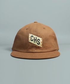 Our CHS Embroidered Charleston hat features hand embroidered and woven patch details, a perfectly worn in feel, front and back woven patch details, and adjustable brass buckle clasp.Made from washed 100% cotton twill fabricFabric strap with adjustable brass buckle claspDue to the handmade nature of this design items may have slight variations Pre-washed Cotton 5-panel Hat, Vintage Cotton Dad Hat One Size, Vintage Cotton Dad Hat One Size Fits Most, Vintage Adjustable Canvas Baseball Cap, Vintage Canvas Baseball Cap With Curved Brim, Vintage Adjustable Dad Hat With Short Brim, Cotton Hats With Letter Patch For Streetwear, Retro Cotton Dad Hat With Embroidered Logo, Streetwear Cotton Hats With Letter Patch