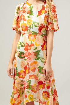 Take on the day in this spritely floral midi dress. A spirited floral print with silver pinstriping is woven into a sheer and flowy fabric. It shapes the Aerin Midi, a flowy dress with sheer, flouncy sleeves frame a lined bodice and asymmetrical skirt. An imbalanced hemline creates an ethereal touch. An elastic waistband is placed along the back side, as well as a keyhole.- Keyhole- Lined- Asymmetrical hem- Elastic waist- Color: Blush MultiSize + Fit - Model is 5'9" and wearing size XS- Measurem Flouncy Sleeves, Figure Dress, Workwear Essentials, Wear To Work Dress, Bold Floral Print, Fashion Bottoms, Fashion To Figure, Flowy Fabric, Color Blush