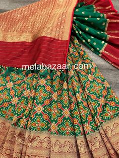 *Fine Silk Patola Saree! *Glamorous saree in green with patola weaving all throughout and Banarsi border *Matching blouse fabric included *Fall attached and designer tassels on the palla Note: The color of the products may slightly vary according to the ambient lighting conditions and the color calibration of LED devices. If you would like more clarity before your purchase, please drop us a message . Festive Green Pre-draped Saree With Self Design, Festive Green Pre-draped Saree With Zari Weaving, Festive Green Pre-draped Saree With Pallu, Transitional Green Art Silk Sharara, Green Art Silk Sharara With Cutdana, Green Cutdana Traditional Wear For Festive Season, Festive Green Paithani Silk Pre-draped Saree, Festive Green Cutdana Traditional Wear, Green Paithani Silk Pre-draped Saree With Self Design