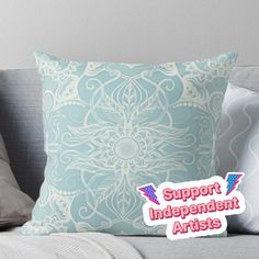 a pillow with the words support independent artists on it and an image of a flower