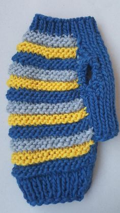 two blue and yellow knitted ties on a white surface