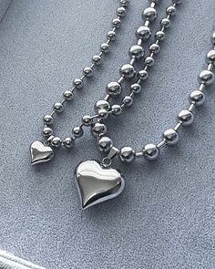 This Necklaces item by ColdShoulderLA has 310 favorites from Etsy shoppers. Ships from Los Angeles, CA. Listed on Jun 11, 2023 Chrome Necklace, 2000s Jewelry, Ball Chain Necklace, Puffed Heart, Mini Heart, Stainless Steel Pendant, Steel Necklace, Chain Choker, Stainless Steel Necklace