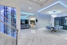 an elegant dining room with marble floors and white walls