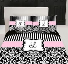 black and white bedding with pink trim, monogrammed pillow cases and matching comforters