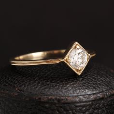 This perfectly elegant engagement ring was inspired by the Gilded Age (1870 - 1900), a period in American history that was characterized by rapid industrialization and streamlined style. For our ring's setting, we borrowed some of the stylistic elements from the era - clean straight lines, a hint of milgrain - and added an antique .40 carat old European cut diamond that would have been popular at this point in history. The low, flat profile is a modern improvement designed for maximum comfort. Timeless Rings With Single Cut Diamonds, Timeless 14k Gold Wedding Ring With Rose Cut Diamonds, Timeless Classic Cut Diamond Ring With Single Cut Diamonds, Timeless Diamond Ring With Single Cut, Timeless Diamond Ring With Single Cut Diamonds, Timeless 14k Gold Diamond Ring, Timeless Rings With Classic Cut Single Diamonds, Timeless 14k Gold Wedding Ring With Single Diamond, Refined Rings With Rose Cut Diamonds