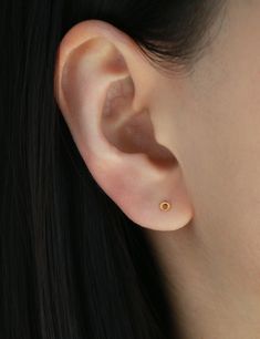 Tiny open circle stud earring - super cute and very versatile, you can pair it with any other earrings or jewelry. D E T A I L S * Circle is 3 mm * 18 gauge post * 16k gold over sterling silver // white gold over sterling silver * Nickel free and hypoallergenic S H O W   U S   S O M E  ♥ Instagram: @Minthologie Facebook: facebook.com/Minthologie Small Circle Stud Earrings, Dainty Round Pierced Plug Earrings, Dainty Circular Earrings, Minimalist Round Pierced Cartilage Earrings, Dainty Circle Earrings For Pierced Ears, Dainty Round Internally Threaded Earrings, Dainty Internally Threaded Round Earrings, Dainty Round Ear Wire Piercings, Earrings Conch