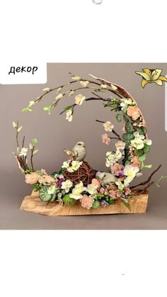 an artistic display with flowers and birds on it