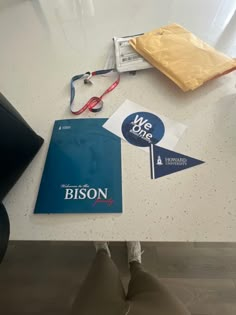 a table with some items on it and a bag sitting next to the table top