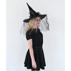 Skeleteen Classic Witch Headpiece is the ideal headwear for any woman dressing up as a cute witch Halloween. This beautiful witch hat can be worn for many style witches, a wicked one, a vintage one, a Victorian one, a creepy one, or a classy one. This hat is made of fancy black fabric, Satin-Feel and has cool decorations on the side that include a black bow with beads, a black veil with spiders hanging down, and some black feather accents. This big felt hat is made to fit most women's heads. Ske Gothic Black Mini Hats For Halloween, Spooky Halloween Costume Hats And Headpieces, Black Mini Hat For Halloween Cosplay, Fitted Witchy Hat For Halloween, Halloween Fitted Wide Brim Costume Hat, Fitted Wide Brim Halloween Costume Hat, Black Witchy Costume Hat, Spooky Black Costume Hat, Witchy Black Costume Hat