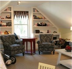 a living room with two chairs and a table