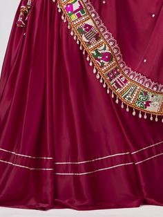 Introducing our amazing maroon gamthi work silk navratri wear lehenga choli, made with maroon satin silk material. This stunning ensemble is perfect for traditional occasions like Navratri, where you want to look elegant and festive.
Let's talk about the benefits of this beautiful lehenga choli. It is made with high-quality satin silk material, ensuring a smooth and comfortable fit. The maroon color adds a touch of sophistication and grace to the overall look. The gamthi work on the choli and at Silk Lehenga With Gota Work For Navratri, Traditional Anarkali Satin Dupatta, Anarkali Satin Dupatta, Satin Dupatta With Resham Embroidery For Eid, Festive Satin Dupatta With Resham Embroidery, Satin Resham Embroidery Sets For Festivals, Embroidered Satin Traditional Wear For Diwali, Diwali Embroidered Satin Traditional Wear, Satin Sets With Resham Embroidery For Festivals