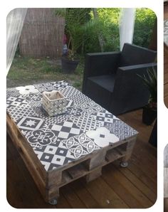 the table is made out of pallet wood and has black and white tiles on it