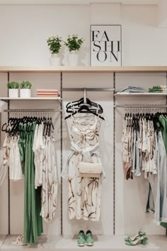 clothes and shoes are on display in a clothing store