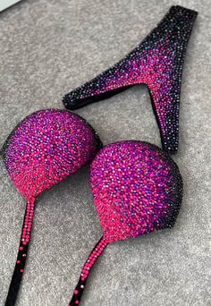 This bikini dazzles with a combination of sparkling black, deep purple, and neon pink rhinestones, creating a vibrant and eye-catching ensemble. The bold and vivid colors of the rhinestones contrast beautifully with the rich black fabric, making it a striking swimwear choice. Production time excluding delivery: finished design - 4-5 weeks; custom design 2-3 months. ----------------------------------------------------- We invite you to see other offers of our store. Pink Shining Crystals Fitness Bride Basket, Brides Basket, Figure Competition, Womens Sports, Beach Swimwear, Pink Rhinestones, Beach Wears, Model Poses, Slovenia