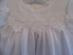 Sophie is one of our cotton embroidered lace christening, baptism, blessing gown! This baby girl dress is made of delicious white embroidered cotton. Sophie baby girl dress is perfect for a warm sunny day and will make any little infant girl feel beautiful! Just look at the embroidery on the skirt of this infant christening, baptism, blessing gown! The lace across the high yolk is a perfect match for the lace on the skirt of this baby girl gown. The laces just adds to the elegance of this infant Fitted First Communion Dress With Lace Trim For Church, Spring Lace Baptism Dress With Lace Collar, White Embroidered Baptism Dress, Fitted Embroidered Baptism Dress For Summer, Embroidered Fitted Baptism Dress For Summer, First Communion Cotton Dress With Lace Trim, Fitted Embroidered Lace Baptism Dress, White Lace Trim Baptism Dress For Church, Summer Embroidered Fitted Baptism Dress