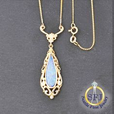 "Opal Doublet Necklace 14K Solid Yellow Gold METAL: Solid 14k Yellow Gold, Stamped 14k GEMS: 1 -- 0.92ct Opal Doublet CONDITION: Restored Vintage LENGTH: 17\" APPRAISED AT: $1,435 *You will receive the exact, one-of-a-kind item pictured.* WHAT SETS SEATTLE FINE JEWELRY APART? + Professional jeweler restored, polished, and cleaned to excellent condition. + All gems graded by GIA Graduate Gemologists. + Professional appraisal certificate included. + Generous 90-day returns & gem authenticity policy. F.A.Q. -- FREQUENTLY ASKED QUESTIONS 1) DO YOU OFFER NO-FEE LAYAWAY PLANS? Yes, we do! Just 20% down, then as many months as you need. Simply contact us to get started. 2) ARE THESE GEMS NATURAL OR LAB CREATED?  Unless otherwise noted, our gems are guaranteed to be natural, earth-mined gems as ce Ornate 14k Stamped Jewelry For Formal Occasions, Antique Yellow Gold Teardrop Necklaces, Antique Teardrop Yellow Gold Necklaces, Antique Yellow Gold Teardrop Necklace, Hallmarked Pear-shaped Yellow Gold Necklace, Yellow Gold Pear-shaped Hallmarked Necklace, Formal Heirloom 14k Stamped Necklaces, Gold Hallmarked Pear-shaped Necklace, Gold Pear-shaped Hallmarked Necklace