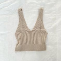 Super Chic Ribbed Knit Top In A Creamy Tan Color! This Tank Top Is Perfect As An Elevated Basic And Is Super Comfortable. Brand New~ Labeled As A Size M. #Chic #Minimalist #Classy #Feminine #Fallfashion Ribbed Beige Knit Top, Beige Soft Knit V-neck Top, Cozy Ribbed Fitted Knit Top, Cozy Fitted Ribbed Knit Top, Beige Knit V-neck Top, Beige V-neck Knit Top, Beige V-neck Cotton Knit Top, Beige Seamless Knit Top, Seamless Beige Knit Top