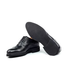 Also known as a wingtip, the Full Brogue is easily identifiable as one of the most classic pairs of men's dress shoes on the market. Featuring a brogue pattern along the sides as well as the toe cap, every man needs a Full Brogue in his shoe closet. Sole units (different available) are Blake stitched to uppers. Upper Materials: Black Box Calf Lining: Black Calf Leather Sole: Black Heeled Rubber Sole Last: Zurigo - Rounded Toe for Traditional English Look YOUR Package Includes Leather shoe cleani Jodhpur Boots, Wood Shoes, Men's Dress Shoes, Wingtip Oxford, Traditional English, Leather Box, Shoe Tree, Shoe Closet, Black Box