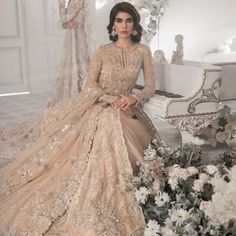 Beige Bridal Lehenga Maxi for Pakistani Wedding Dresses is an attractive dress to wear at the walima. This breathtaking attire is gracefully embellished with beige maxi lehenga and adornments giving a dreamy look to the Bride. The premium quality fabric of this perfectly stitched attire makes this Traditional Bridal Dress your foremost priority. Beige Lehenga Gown: Walking into a new chapter of your life with the joy of togetherness and the magic of love. NameerabyFarooq presents a walima outfit Tissue Gown, Walima Outfit, Beige Lehenga, Pakistani Bridal Lehenga, Pakistani Bridal Dress, Bridal Dupatta, Pakistani Designer Clothes, Attractive Dresses, Lehenga Gown