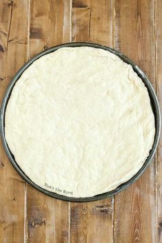 the dough is ready to be baked in the skillet on the wooden table top