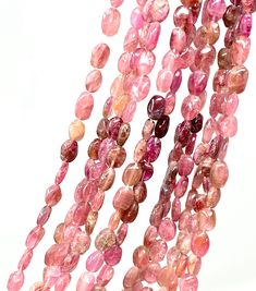 pink tourmaline beads on white background