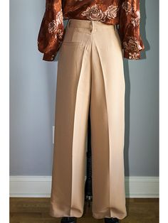 FEATURES Elegant, Classy & Chic High Waisted Wide Leg Pants The wide-leg trouser is a flattering and chic silhouette designed to flatter your shape. Adding a front pleat and pockets, these trousers have a relaxed but tailored construction. Button/zip fly closure with front button, zipper fly, and belt loops. FABRIC 78% Polyester, 18% Rayon, and 4% Spandex Imported SIZE + FIT Sizing is True to Size | Tapered Fit with minimal stretch Size Bust Waist Hip Small (2-4) 36” - 37” 27” – 28” 36” – 37 Fitted Workwear Pants With Wide Waistband, Chic Fitted Wide Leg Pants With Wide Waistband, Fitted Pants With Wide Waistband For Work, Non-stretch High-waisted Formal Pants, Formal Non-stretch High-waisted Pants, Fitted Wide Leg Office Bottoms, Elegant Fitted Wide Leg Bottoms, Elegant Stretch Long Pants, Beige Wide Leg Bottoms For Evening