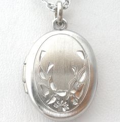 Vintage Jewelry - This is a sterling silver 18" link chain with a small oval locket pendant. The pendant is .75" (includes jump ring) by almost .5" wide, weighs 3 grams, and is hallmarked Sterling, signed WEB. Classic Sterling Silver Oval Locket Necklace, Oval Hallmarked White Gold Locket Necklace, Oval White Gold Hallmarked Locket Necklace, Classic Sterling Silver Oval Link Locket Necklace, Nickel-free Oval Silver Necklace, Silver Oval Link Necklaces For Weddings, Engraved Oval Sterling Silver Locket Necklace, White Gold Sterling Silver Oval Pendant Locket Necklace, Oval Nickel-free Silver Necklace