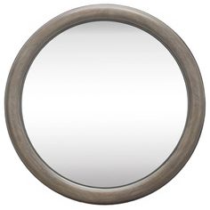 a round mirror on a white wall