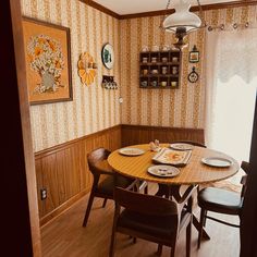 a dinning room table with plates on it