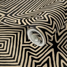 a black and white wallpaper with an abstract design on it's surface,