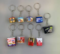 a bunch of food items that are on a keychain with each one being held by a metal ring