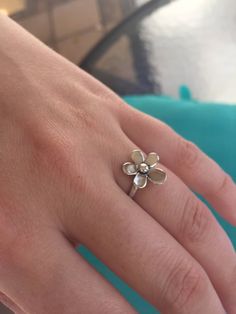 A gorgeous, highly-crafted, sterling silver Daisy Ring. This is a romantic ring with a delicate Daisy/ Plumaria flower on a Sterling silver band. A truly elegant  ring.The Plumaria a flower of ancient India known for its enchanting fragrance, in Hawaii it symbolizes Positivity and to celebrate special occasions. We use the purest 925 sterling silver in all of our designs.  We strive to provide you with a meticulously crafted piece of beautiful jewelry. All of our rings come with a high shine fin Delicate Silver Flower Open Ring, Sterling Silver Jewelry With 3d Flower Design, Sterling Silver Jewelry With 3d Flowers In Silver, Silver Flower Charm Ring For Wedding, Dainty Sterling Silver Flower Open Ring, Dainty Sterling Silver Open Flower Ring, Silver Flower Promise Ring, Sterling Silver Flower Ring For Wedding, Sterling Silver Flower Ring Gift