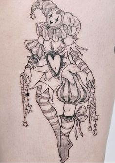 a woman with a heart tattoo on her thigh is holding a candy cane and looking at the camera