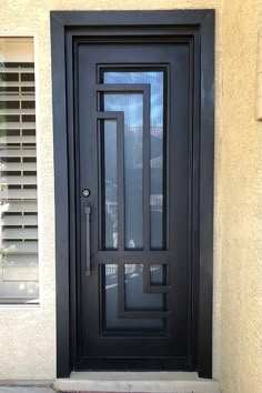 a black front door with blinds on the side