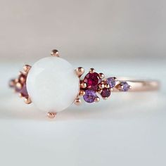 Beautiful handmade item! Here, on Etsy made as simulation only-just resin and white color.  Breastmilk Ring made with white gold plated sterling silver or plated with rose or yellow gold. Opal effect breastmik 7mm diamond shaped stone. Any size available. Rose gold,  or white gold plated options.  Pearl powder or opal effect can be added to this fine breastmilk ring.  Symbolic of the little diamond you brought into this world, our breastmilk stone ring shines bright. Beautiful inlaid cubic zirconia surround and accentuate your breastmilk stone while a skin-friendly 925 sterling silver ring core.  To see our full breastmilk Ring collection, please click here: https://www.etsy.com/ca/shop/KeepsakeMom?ref=simple-shop-header-name&listing_id=1095328032&section_id=24695275 To see All our items, Unique White Multi-stone Moonstone Ring, White Enamel Fine Jewelry Ring, Oval White Ruby Gemstone Ring, White Enamel Gemstone Ring, White Moonstone Ring In 14k Gold For Promise, White Moonstone Promise Ring In 14k Gold, White 14k Gold Moonstone Promise Ring, White Enamel Ring With Gemstone For Anniversary, White Gemstone Jewelry For Gifts