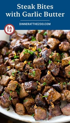 steak bites with garlic butter on a white plate