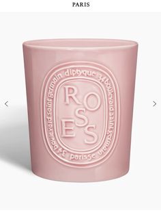 a pink glass with the words roses on it