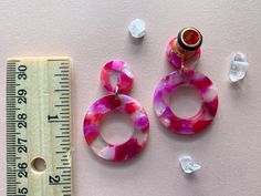 6g (4mm) - 00g (10mm) Small Purple/Pink Multi-Color Acetate Lightweight Tear Hoop Drop Dangle Earrings Gauges/Earplugs Hider Plugs. The plug in this photo is 2g. Disc size will NOT vary with size of gauge ordered. The plugs themselves are stainless steel w/black silicone 'o' ring. Disc and hoop are acetate acrylic. Please allow for minor imperfections as these are handcrafted pieces. Only wear in healed ears as these are not meant for stretching. All earrings are made to order and sold in pairs. Earrings Gauges, Drop Dangle Earrings, O Ring, Stretching, Fashion Statement, Feline