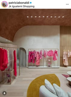 a room filled with lots of pink clothes