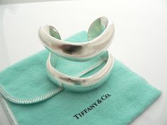 Overview:Offered for sale is a wonderful, super cool, and gorgeous Tiffany & Co Silver Peretti Double Open Cuff / Bracelet. Definitely a Tiffany piece that you will get your money's value for. It works perfectly with pretty much any attire your put on, AND is the perfect Tiffany statement piece. It is the perfect piece that fits a lifestyle on the go -- the cuff can be worn to pretty much any occasion! It is simple, elegant, and classic all rolled into one bracelet - it looks awesome worn al Designer Polished Cuff Bracelet As Gift, Designer Polished Finish Cuff Bracelet As Gift, Designer Polished Cuff Bracelet Gift, Luxury Open Cuff Bracelet As Gift, Luxury Wide Band Cuff Bracelet As Gift, Luxury Wide Band Cuff Bracelet Gift, Luxury Open Cuff Bracelets As Gifts, Luxury Open Cuff Bracelets For Gifts, Luxury Open Cuff Bracelet For Gift