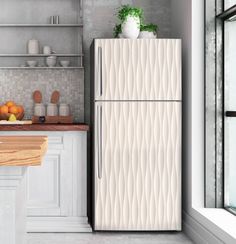 a white refrigerator freezer sitting inside of a kitchen