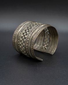 A beautiful relic from the past, this vintage silver cuff is crafted with passion by skilled artisans from the Turkman tribe, each design element tells a unique story waiting to be unraveled. This item will ship directly from Bali via DHL delivery. Please allow up to 15 business days to arrive. Artisan Jewelry With Oxidized Finish For Festivals, Artisan Oxidized Finish Jewelry For Festivals, Unique Oxidized Metal Cuff Bracelet, Unique Metal Cuff Bracelet With Oxidized Finish, Traditional One-of-a-kind Brass Jewelry, Vintage Hand Forged Brass Bracelets, Artisan Brass Bangle, Antique Brass Cuff Bracelet Gift, Artisan Bangle As Festival Gift