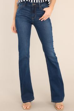 These dark wash denim jeans feature a classic button and zipper closure, belt loops, front and back pockets, a flared cut, and a dark wash. Standing Out From The Crowd, Dark Wash Flare Jeans, The Flare, Red Dress Boutique, Fun Loving, Boutique Dresses, Hip Length, Unique Fashion, Flare Jeans