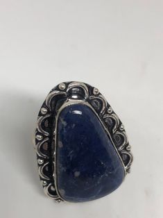 Large genuine blue Lapis Lazuli Vintage ring Low content silver not sterling. Size 9 Can be re sized. My jeweler charges $10-$20 All rings are shipped free in the US in a nice gift box. Check out our over a THOUSAND great reviews Engraving is $4 per letter and is not always perfect depending on the piece. It can take a few days if the jeweler is busy. This is payable to Paypal Judithsltd@gmail.com Bohemian Blue Collectible Ring, Vintage Blue Ring With Large Stone, Silver Sapphire Ring With Large Stone As Gift, Collectible Blue Gemstone Ring, Blue Large Stone Ring Jewelry, Blue Jewelry Stamped 925 As Gift, Classic Handmade Blue Rings, Classic Handmade Blue Ring, Classic Adjustable Blue Rings