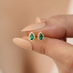 Discover timeless elegance with our handcrafted 14K solid gold earrings, featuring genuine diamonds and vibrant emerald gemstones, the birthstone for May. These luxurious drop stud earrings are meticulously designed to offer both style and sophistication. Each piece is carefully created with the highest quality materials, ensuring that you receive a product not only beautiful but also durable. Dimensions for these exquisite earrings are thoughtfully chosen to enhance aesthetic appeal while provi Formal Emerald Earrings With Birthstone, Formal Emerald Birthstone Earrings, Emerald Earrings With Diamond Accents For Gifts, Gold Emerald Diamond Earrings, Pear-shaped Diamond Earrings With Gemstones As A Gift, Pear-shaped Emerald Earrings For Anniversary, Fine Jewelry Green Diamond Earrings For Gift, Fine Jewelry Green Diamond Earrings As Gift, Green Teardrop Diamond Earrings For Anniversary