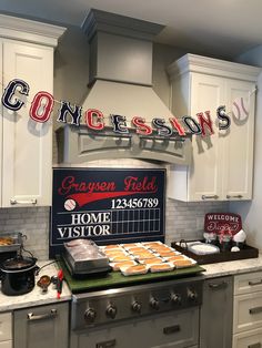 a kitchen with white cabinets and a sign on the wall that says, concesions