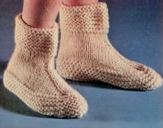 the legs and feet of a person wearing knitted socks