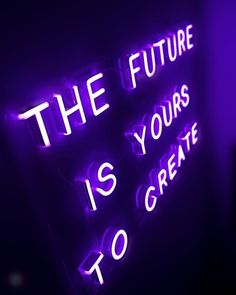 a neon sign that says the future is yours to create us happy with purple light