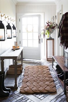 a living room with a rug on the floor